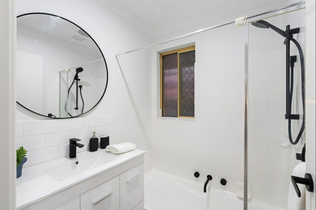 Renovated bathroom in Perth featuring modern fixtures and finishes following full home renovation by Your Trade Solutions