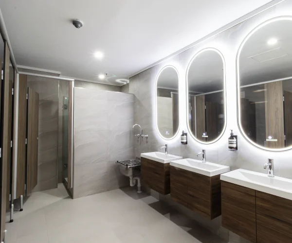 Completed hotel bathroom renovation in Perth featuring modern fittings by Your Trade Solutions