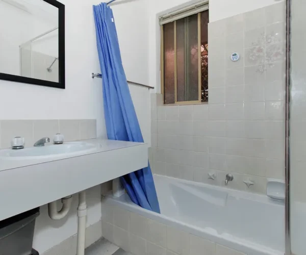 Bathroom before renovation in Perth with original bathtub and vanity prior to full home upgrade by Your Trade Solutions